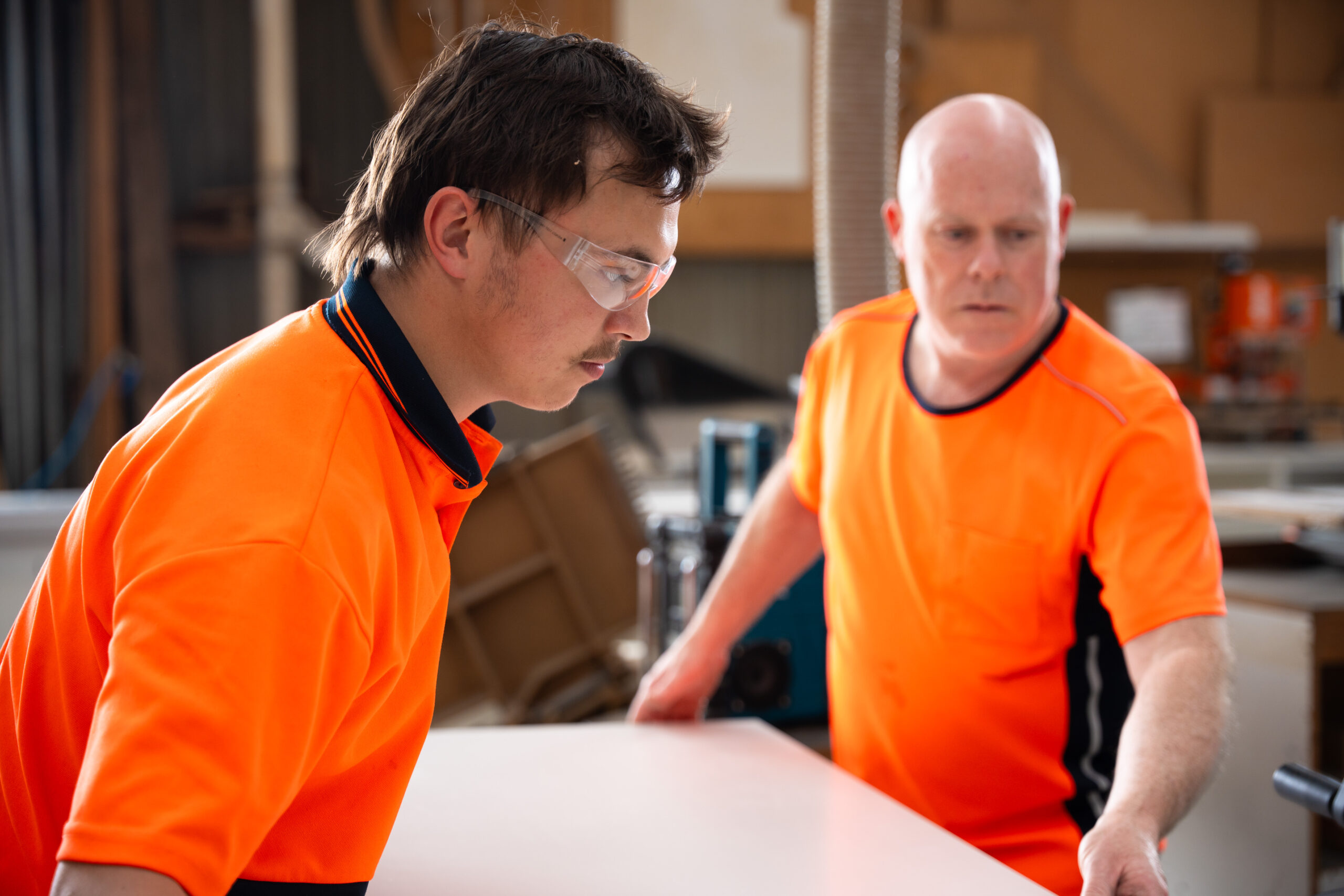 Two cabinetmakers working